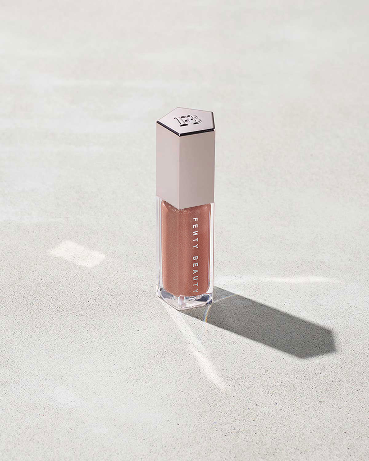 FB3006_PROD_GLOSS_BOMB_FENTY_GLOW_CLOSED_72_1.jpg Gloss Bomb Universal Lip Luminizer - Fenty Glow - Image 1