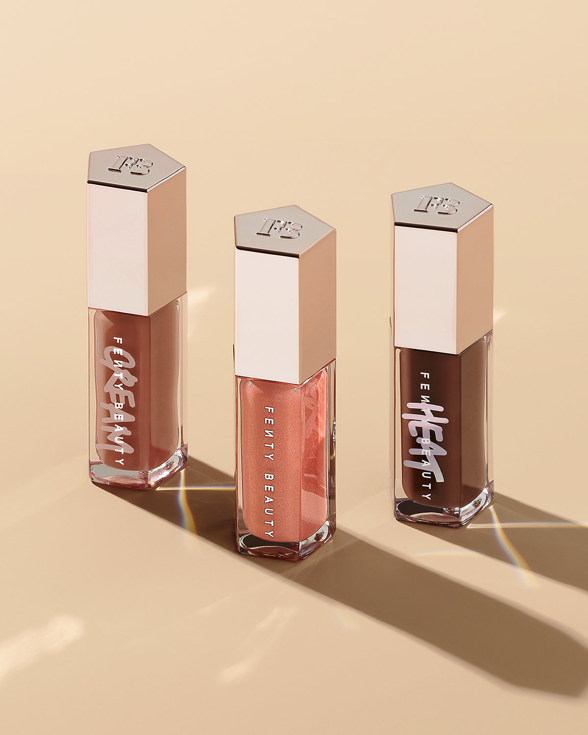 FB_FALL23_T2PRODUCT_EDITORIAL_BUNDLE_LIP_GLOSSBOMB_FENTYGLOW_HOTCHOCOLIT-HEAT_CREAM_1200X1500_72DPI.jpg Triple Drip Gloss Bomb Trio - Image 1