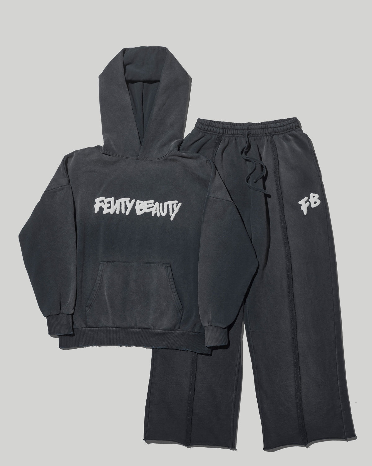 FB_SPR26_T2PRODUCT_EDITORIAL_EXCLUSIVEMERCH_FULL-SET_1200X1500_72DPI.jpg Fenty Beauty Oversized Unisex Hoodie and Sweatpant Set - Image 1