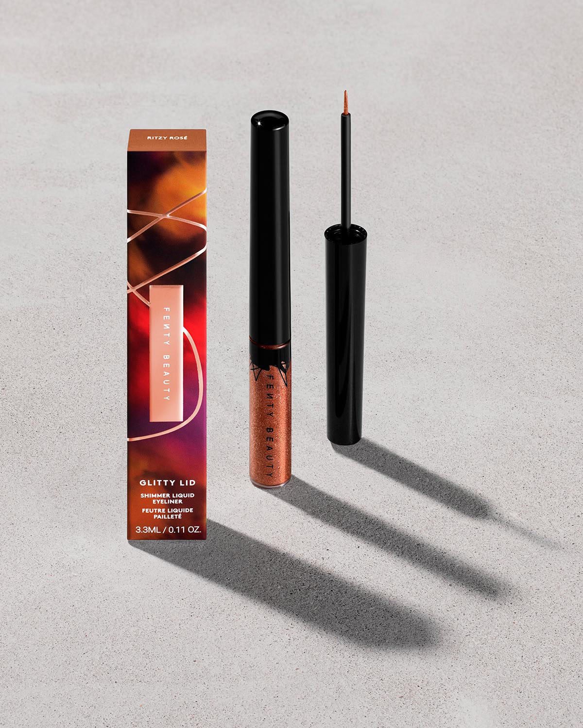 FB_SUMR24_T2PRODUCT_ECOMM_LESUMMER_GLITTYLID_OPEN_SECONDARY_RITZYROSE_sRGB72.jpg Glitty Lid Shimmer Liquid Eyeliner - Bronze All Ova Collection: Ritzy Rose - Image 1